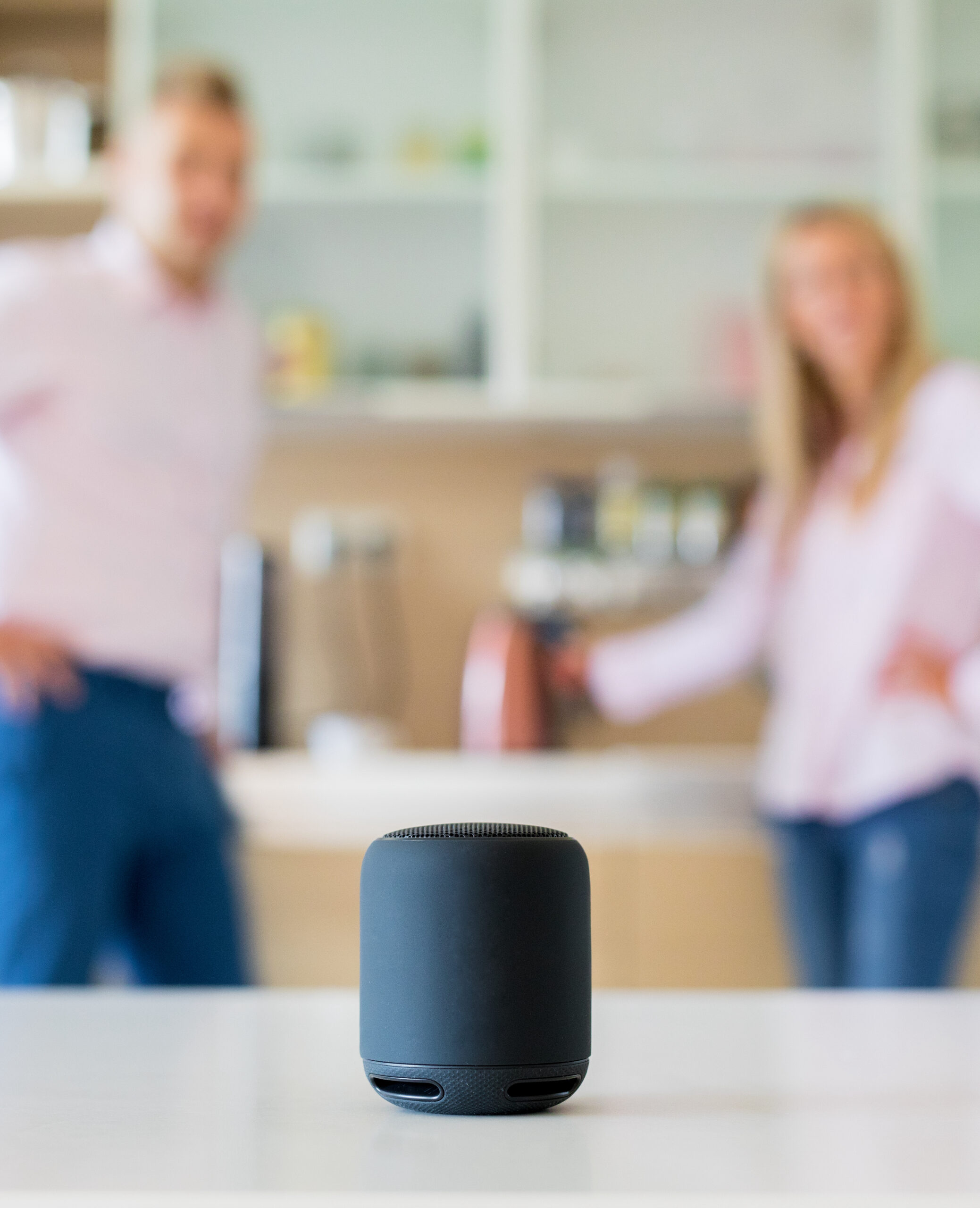 Couple using smart speaker at home women at an ATM in bank